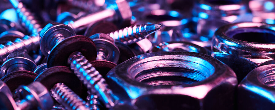 Set of bolts nuts nails metal fasteners. Consumable hardware tools. assortment steel screws collection close up background