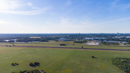 Aerial view from plane landing. Runway of former airport in Neubiberg, south Germany seen from above