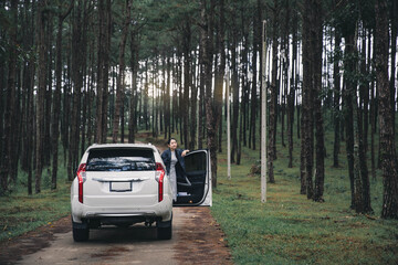 Women travel relax in the holiday. Traveling by car park. happily With nature, rural forest. In the summer. Woman travelling in the nature in free time on holiday with happy.