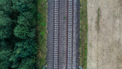 Train tracks through German forest near Munich aerial drone view fotage