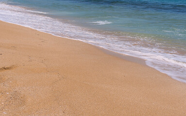 Clear emerald green sea with clean sandy beach