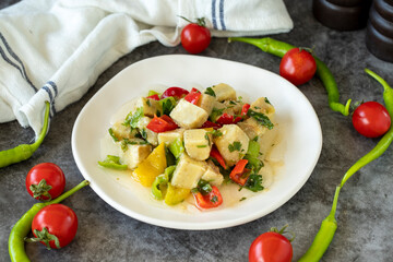 Artichoke Salad. Artichoke salad with olive oil on a dark background. Healthy meals. close up