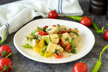Artichoke Salad. Artichoke salad with olive oil on a dark background. Healthy meals. close up