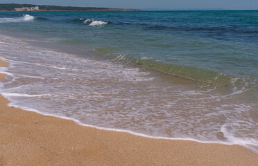 Clear emerald green sea with clean sandy beach