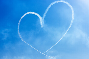 Two Light Airplanes In The Sky Writing Romantic Heart Shape