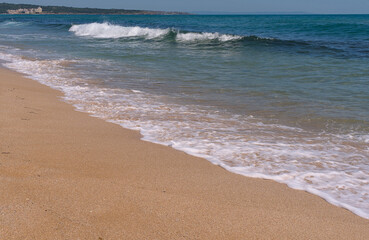Clear emerald green sea with clean sandy beach