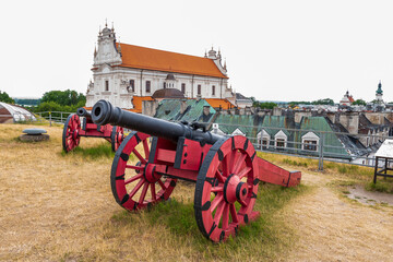 Cannons against the background of the old town. View from the city walls of Zamość. Poland