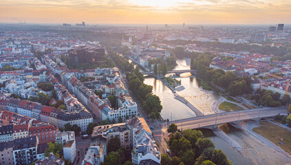 Aerial view of Munich city centre with Isar river flowing past the Deutsches Museum at sunrise