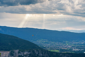 Parachutist above the mountain around Annecy lake