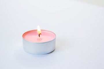 Fototapeta na wymiar burning candle on a dark background