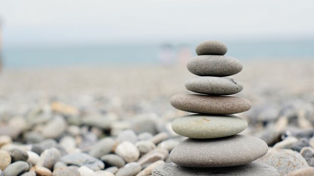Closeup of stacked stones on sea beach