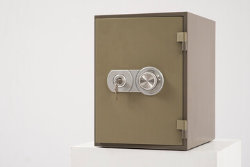 safe with combination lock and key on white background isolated