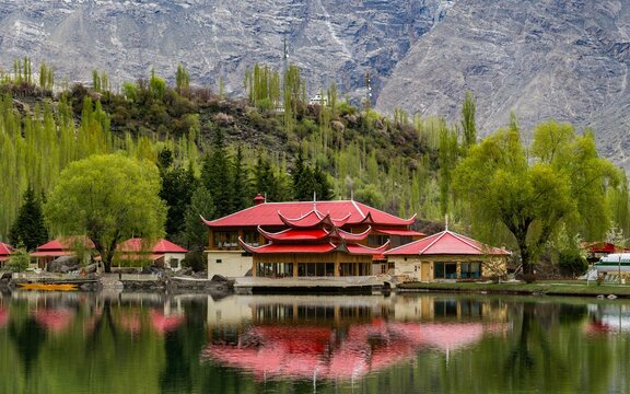 Asian red-roof buildings on the shore of Upper Kachura Lake in Skardu, Pakistan