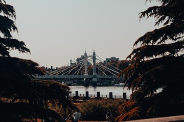 Large suspension Albert Bridge across a wide river in Central London