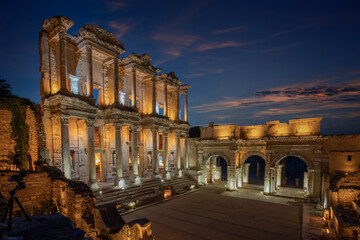 Celsus Library in the ancient city of Ephesus in Izmir, Turkey. Evening lights are on.