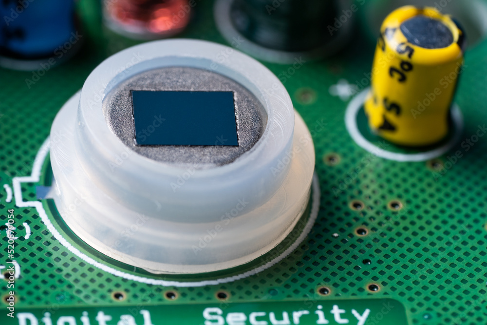 Poster close-up of the motion sensor of security systems on the electronic board.