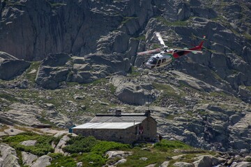 Helicopter over a mountain refuge in the Pyrenees, France