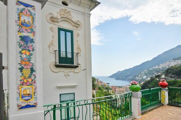 Balcony and window of a painted Italian house overlooking the Amalfi coast in Vietri sul Mare