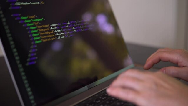 Person is learning to program. Footage with hands and laptop.