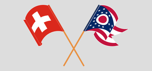 Crossed and waving flags of Switzerland and the State of Ohio