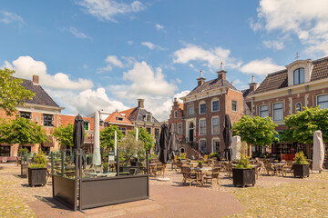 Summer view of the city center square with pubs and restaurants in Workum, Friesland, The...