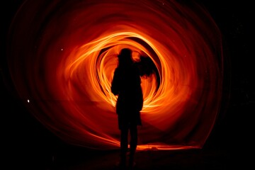 Long exposure shot of light trails against a dark background