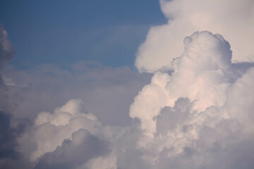 Fototapeta na wymiar Fluffy voluminous white clouds in a blue sky