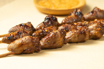 BBQ Chicken Heart Skewers on Kraft Paper