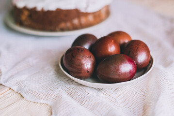 Easter table with traditional Easter cakes and Easter eggs with blossoming tree branch