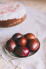 Easter table with traditional Easter cakes and Easter eggs with blossoming tree branch
