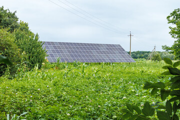 Solar panels set near a rustic house.