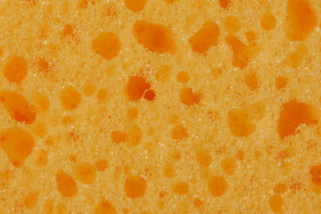 Kitchen sponge orange yellow texture background backdrop