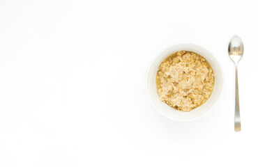 A bowl of oatmeal with blueberries on a white banner with space for text. English breakfast . Healthy food concept.