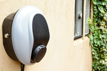 Wall mounted car charging unit to supply power to electric vehicles