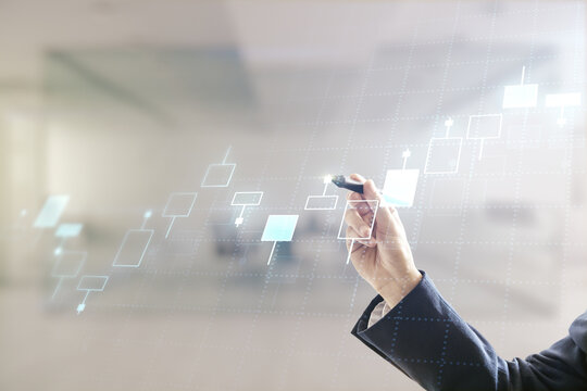 Double exposure of man hand with pen working with abstract creative financial chart hologram on blurred office background, research and strategy concept - Powered by Adobe