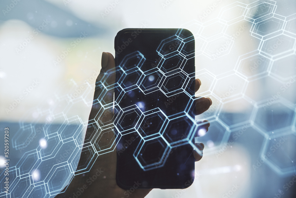 Aufkleber creative concept of wireless technology with hexagon hologram and hand with phone on background. big