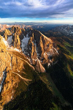 Aerial view of Sassopiatto group and Cinque Dita sharp mountains at sunset, Dolomites, South Tyrol, Italy
