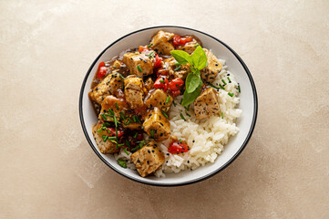Tofu with white rice, stir fry tofy meat in bowl. Healthy vegan food