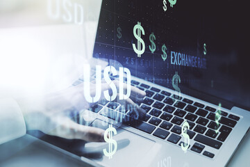 Creative concept of USD symbols illustration and hands typing on laptop on background. Trading and currency concept. Multiexposure