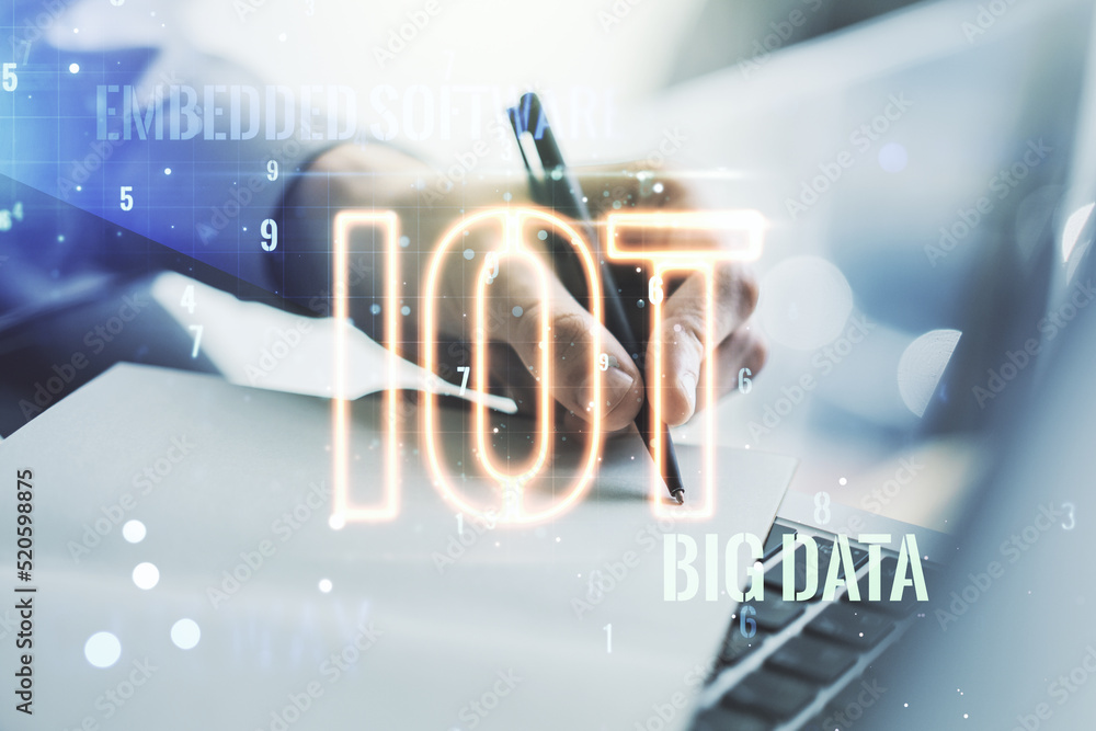 Poster creative iot hologram with hand writing in notepad on background with laptop, internet of things con