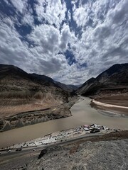 Vertical shot of the confluence of Indus and Zanskar rivers in Nimmoo valley, Ladakh, India