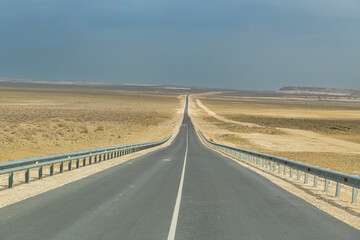 Long straight road in Mangystau, Kazakhstan