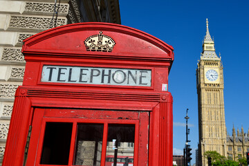 Iconic red telephone box with Big Ben (Elizabeth Tower) in background, Westminster, London, England, United Kingdom