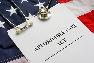 Affordable Care Act ACA, flag and stethoscope.