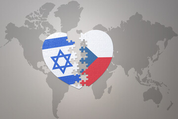 puzzle heart with the national flag of czech republic and israel on a world map background.Concept.