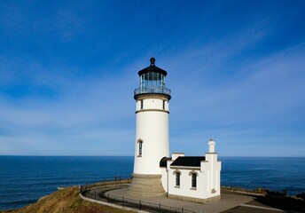 Lighthouse on a hill against seascape