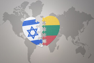 puzzle heart with the national flag of lithuania and israel on a world map background.Concept.