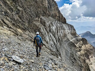 Naklejka premium Mountaineering in extremely steep terrain. Climbing on the Bifertenstock in Swiss Alps. Extreme sports. Wanderlust. High quality photo