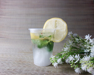 limonade with ice and mint and flowers and fruits