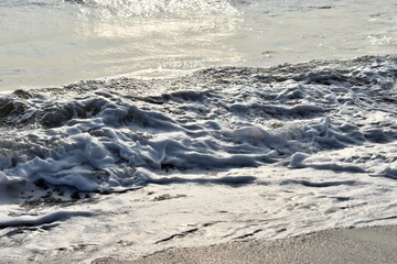 frothy waves on the beach